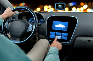 transport, modern technology and people concept - close up of man driving car and pointing finger to car icon on board computer screen