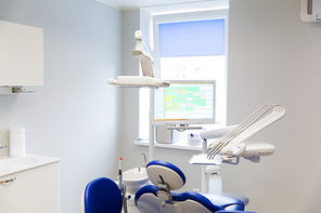 medicine, stomatology, dentistry and health care concept - dental clinic office with medical equipment