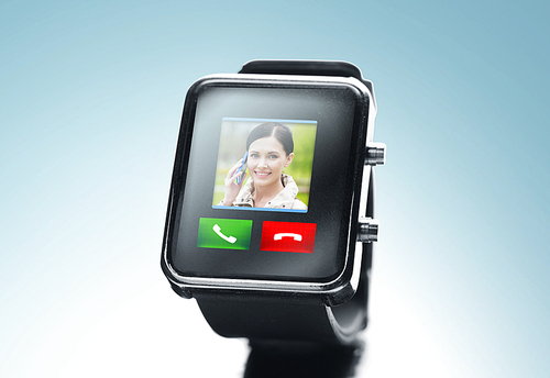 modern technology, communication, object and media concept - close up of black smart watch with video call contact icon and buttons over blue background