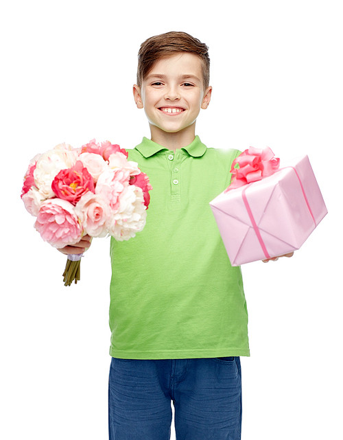 childhood, holidays, presents and people concept - happy boy holding flower bunch and gift box