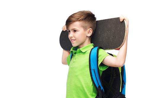 childhood, leisure, school and people concept - happy smiling student boy with backpack and skateboard