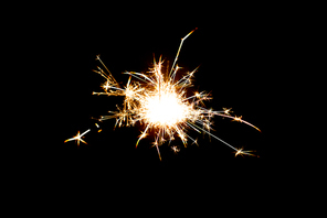 christmas, holidays, new year party and pyrotechnics concept - sparkler or bengal light burning over black background