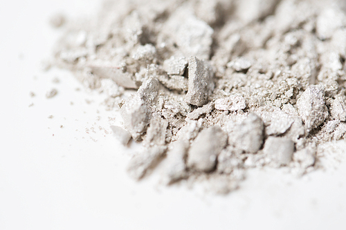 cosmetics, makeup and beauty concept - close up of loose eyeshadow or make-up powder pigment
