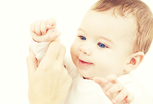 bright picture of adorable baby boy over white