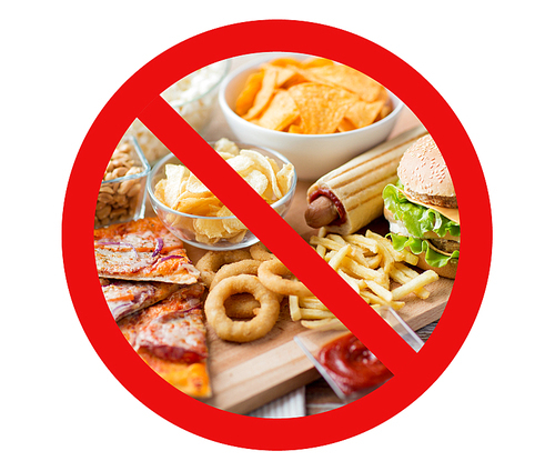 fast food, low carb diet, fattening and unhealthy eating concept - close up of fast food snacks and cola drink on wooden table behind no symbol or circle-backslash prohibition sign