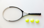 sport, fitness, healthy lifestyle and objects concept - close up of tennis racket with balls
