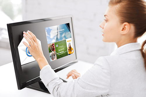 business, people, technology, communication and mass media concept - woman with web pages and e-mail icon on computer touchscreen in office