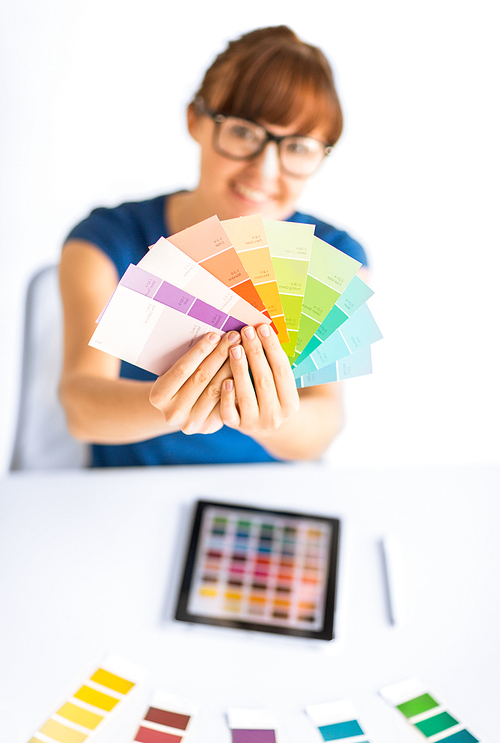 interior design, renovation and technology concept - woman working with color samples for selection