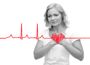 people, healthcare, heart disease and problem concept - unhappy woman suffering from heartache