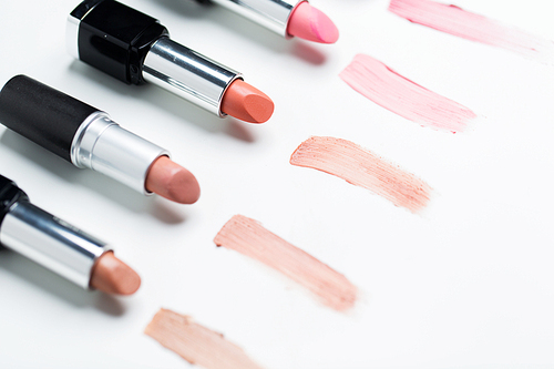 cosmetics, makeup and beauty concept - close up of lipsticks range
