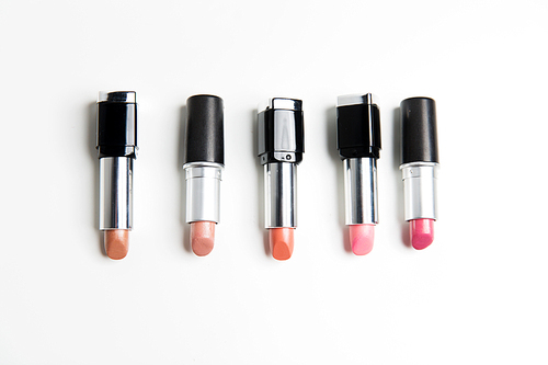 cosmetics, makeup and beauty concept - close up of lipsticks range