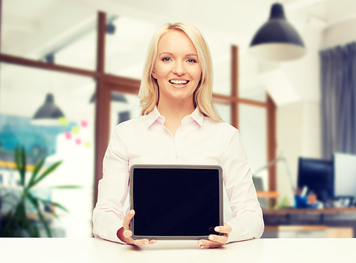 education, business and technology concept - smiling businesswoman or student showing tablet pc computer blank screen over office room background