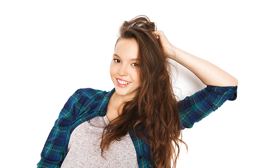people, hair care, style and teens concept - happy smiling pretty teenage girl touching her head