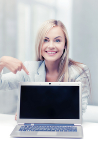 picture of smiling businesswoman with laptop computer