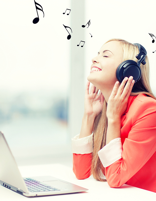 happy woman with headphones listening to music