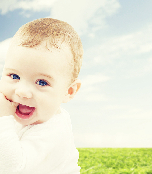 child, people and happiness concept - adorable baby boy