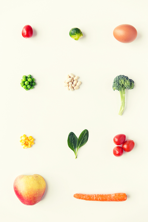 healthy eating, vegetarian food,  and culinary concept - close up of ripe vegetables and food over white