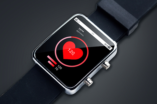modern technology, object, healthcare and media concept - close up of black smart watch with pulsometer and heart-rate icon on screen