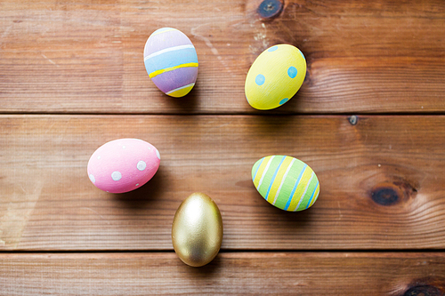 easter, holidays, tradition and object concept - close up of colored easter eggs