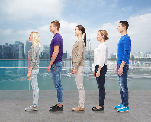 family, gender, high and people concept - group of men and women from side over singapore city waterside background