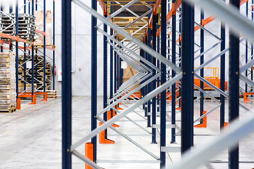 logistic, storage, shipment, industry and manufacturing concept - warehouse shelves or constructions with cargo