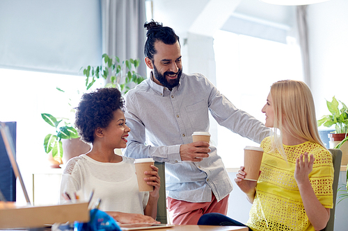 business, startup, people and teamwork concept - happy creative team drinking coffee in office