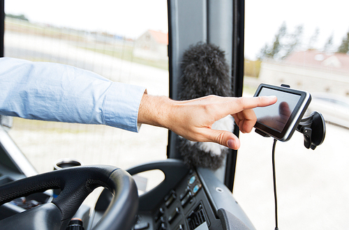 transport, transportation, tourism, navigation and people concept - close up of bus driver with gps navigator driving passenger bus