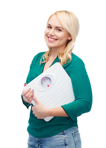 weight loss, diet, slimming, plus size and people concept - smiling young woman holding scales