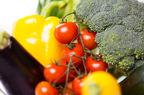 diet, vegetable food, healthy eating and objects concept - close up of ripe vegetables in glass bowl on table