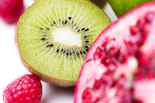 healthy eating, food and diet concept- close up of ripe kiwi and other fruits