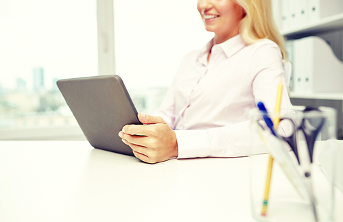 education, business, people and technology concept - close up of smiling businesswoman or student with tablet pc computer in office