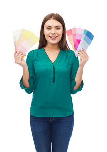 color scheme, decoration, design and people concept - smiling young woman with color swatches or samples