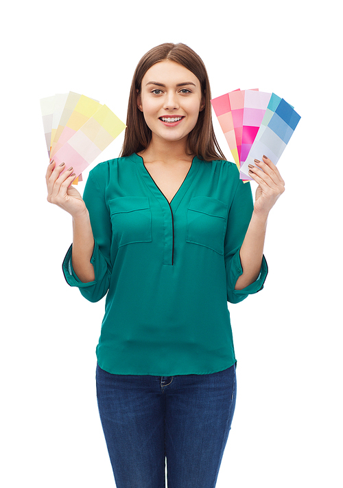 color scheme, decoration, design and people concept - smiling young woman with color swatches or samples