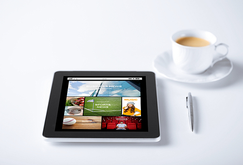 business, mass media and technology concept - tablet pc computer with internet news application cup of coffee