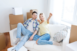 people, repair and real estate concept - smiling couple with boxes moving to new home and dreaming