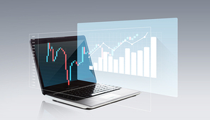 technology, business, statistics, economy and success concept - laptop computer with chart on screen over gray background