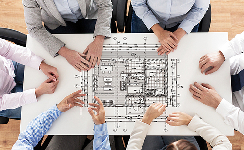 business, people, architecture and team work concept - close up of architects team hands and blueprint on office table