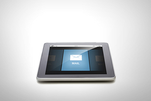 technology, communication, information, business and modern gadget concept - close up of tablet pc computer with email message screen over gray background