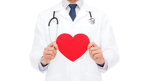 medicine, profession, and healthcare concept - male doctor with red heart and stethoscope