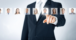 human resources, career management, recruitment and success concept - man in suit pointing to of many business people portraits