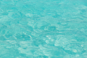 travel, tourism, vacation and summer holidays concept - sea or ocean blue transparent water