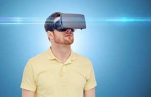 3d technology, virtual reality, entertainment and people concept - young man with virtual reality headset or 3d glasses over blue background and laser light
