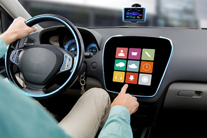 transport, road trip, car driving, technology and people concept - close up of male hand pointing to on-board computer menu