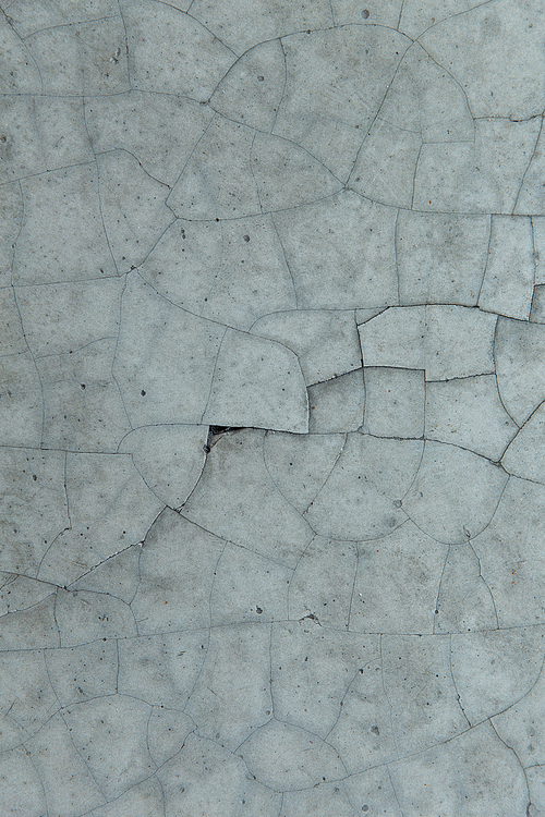 background and texture concept - cracked gray concrete wall