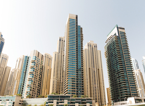 cityscape, travel, tourism and urban concept - Dubai city business district with skyscrapers
