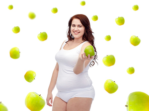 weight loss, diet, slimming, healthy eating and people concept - happy young plus size woman in underwear with green apple