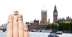 travel, tourism, family, people and body parts concept - close up of four fingers with smiley faces over london city background