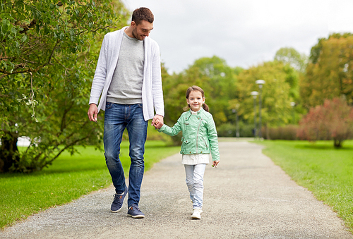 family, parenthood, fatherhood, adoption and people concept - happy father and little girl walking in summer park