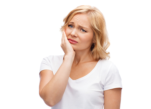 people, healthcare, dentistry and problem concept - unhappy woman suffering toothache