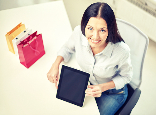 business, technology, communication and people concept - close up of woman with tablet pc computer at office or home